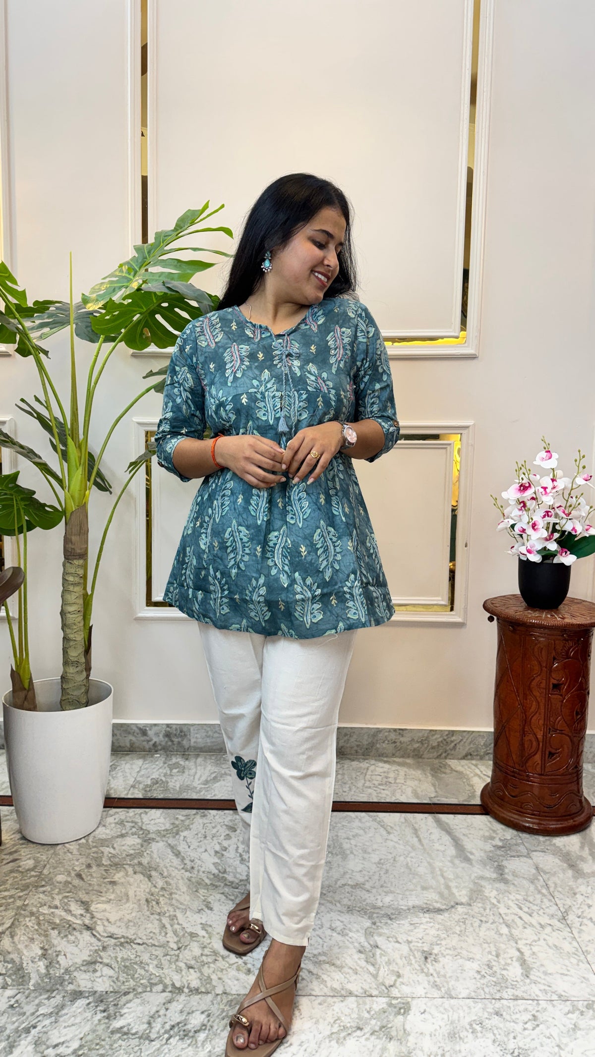 Close view of the tie-up neckline and tassel on the teal batik print kurti