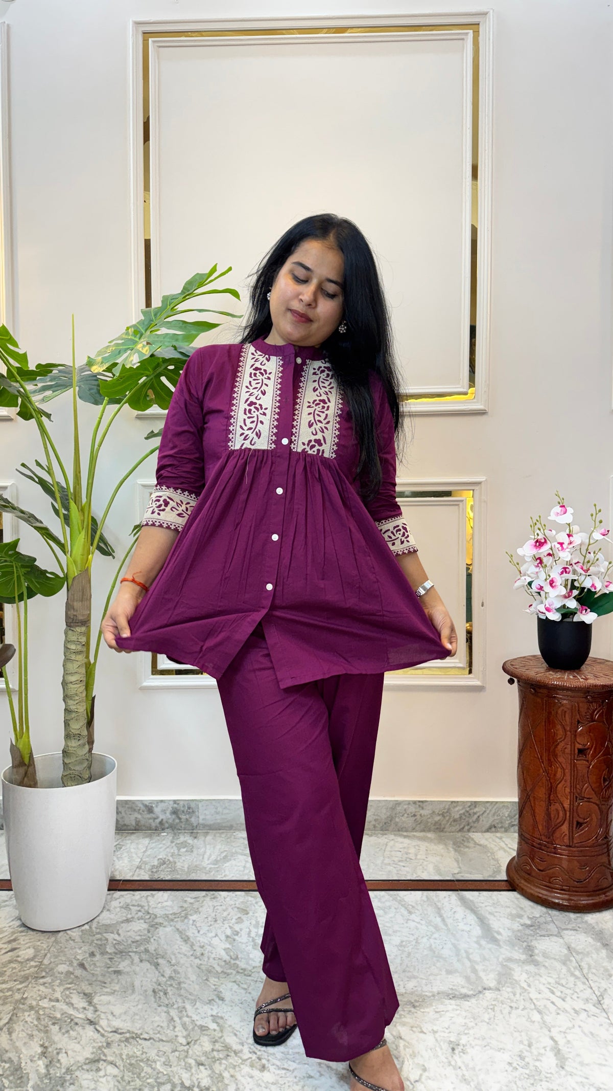 Wine purple cotton rayon kurti held out to show its gathered A-line flare