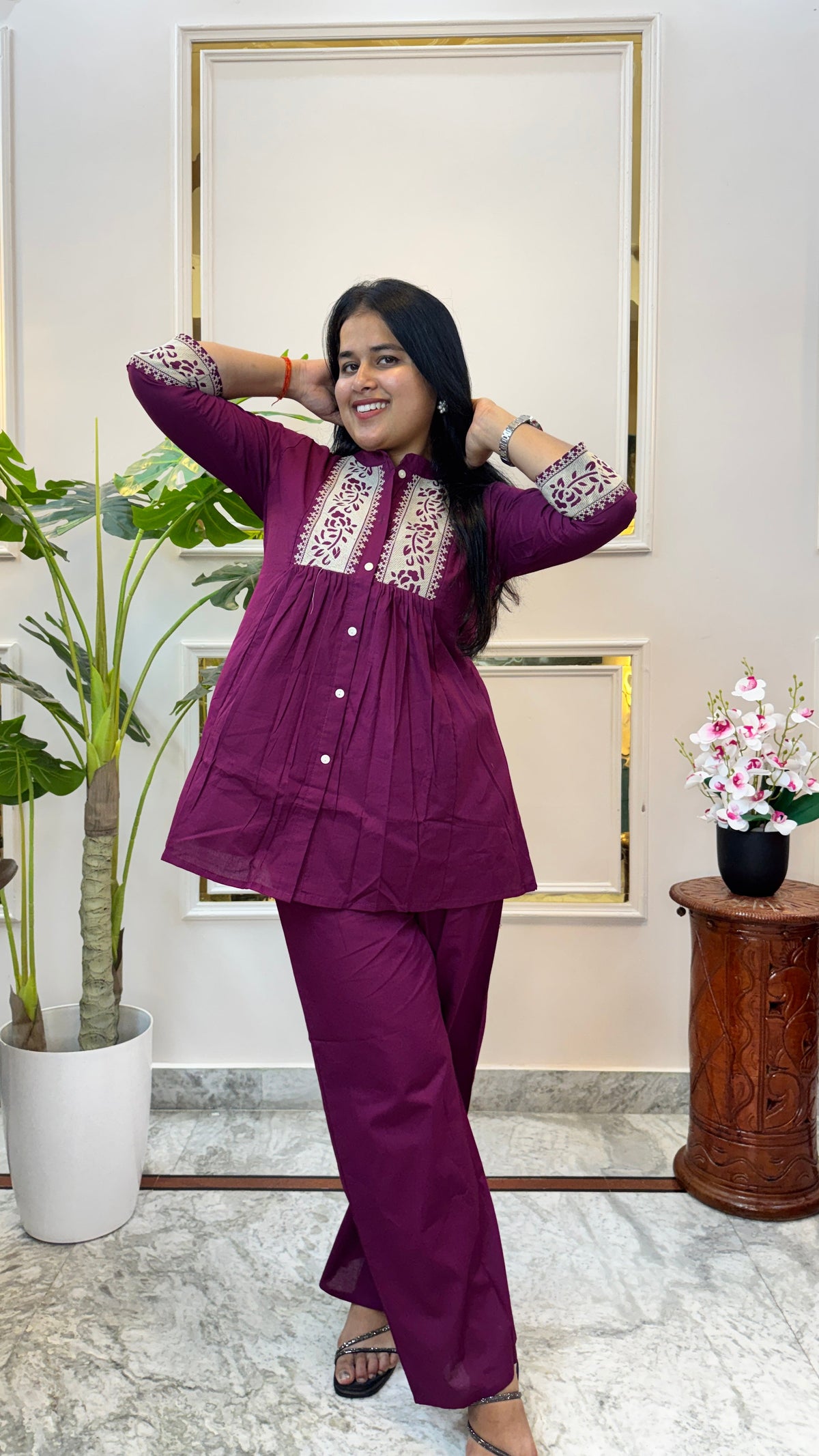 Full length view of the Brisora wine purple floral print kurti and palazzo set